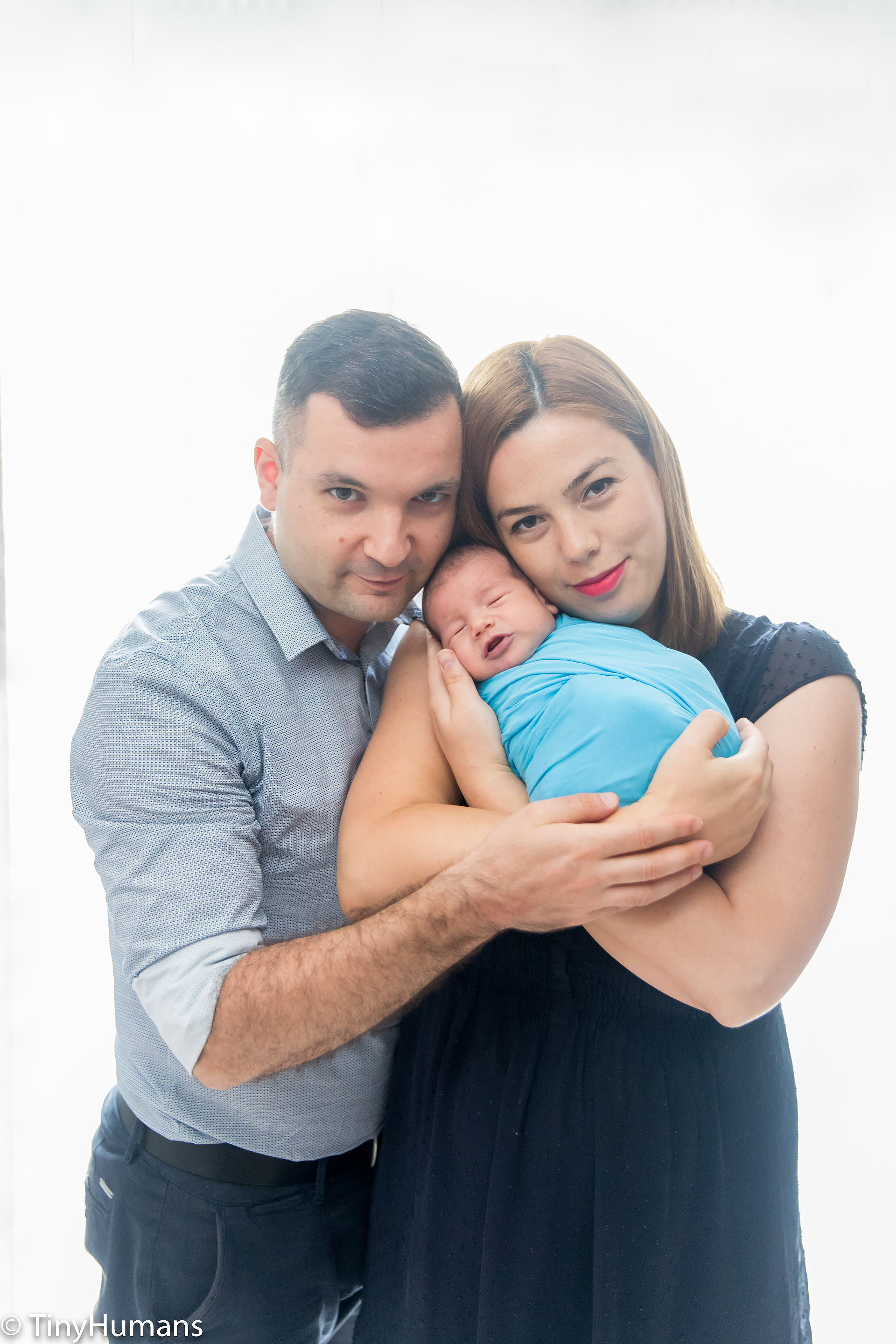 Parents with newborn baby at photo session