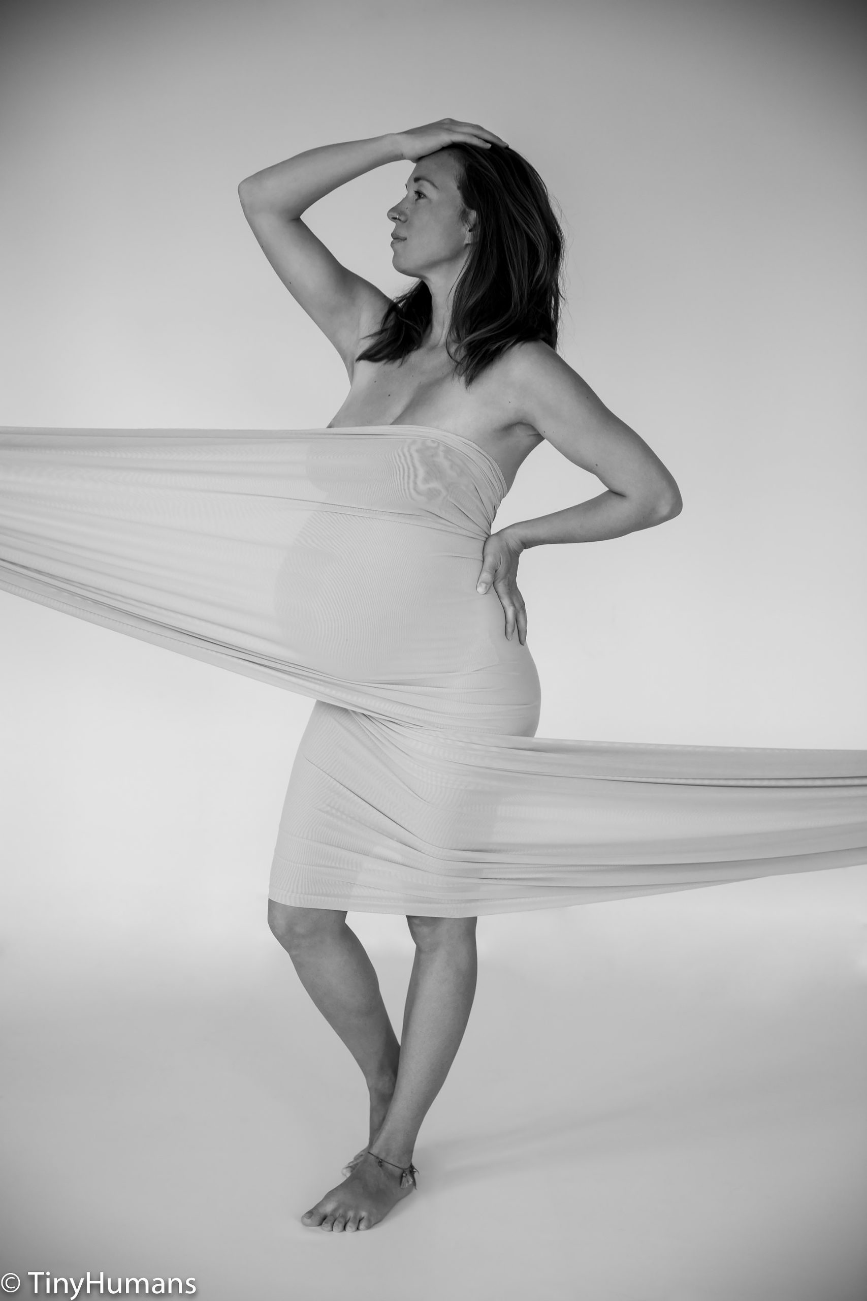 playing with materials at pregnancy photo shoot